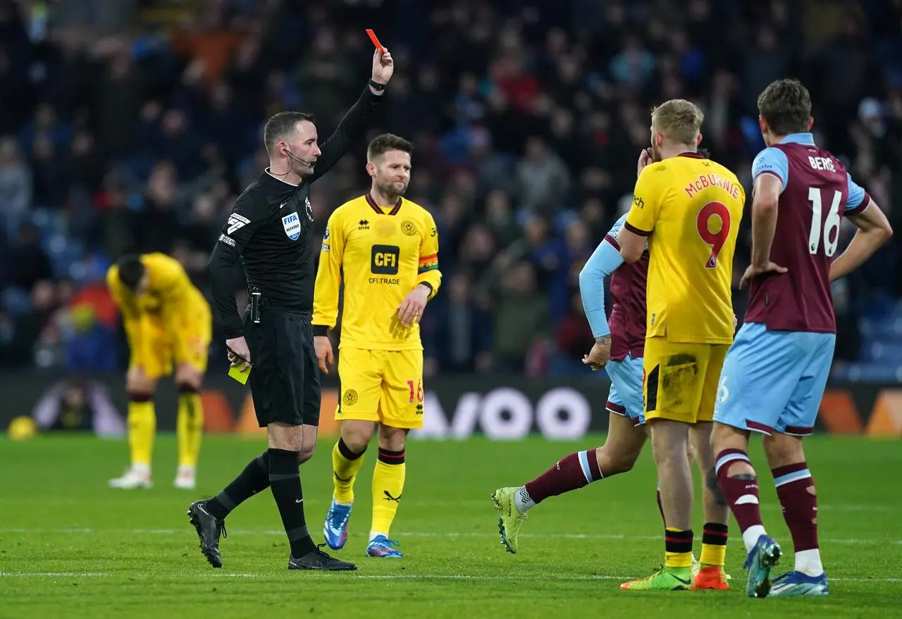 Oli McBurnie, second right, reacts after being sent off against Burnley 