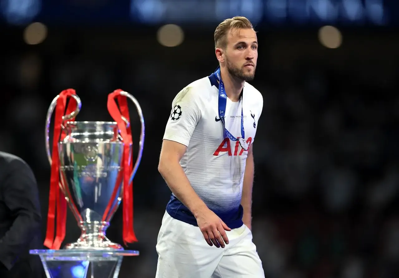 Harry Kane walks past the trophy after collecting his runner’s up medal following Champions League final defeat to Liverpool