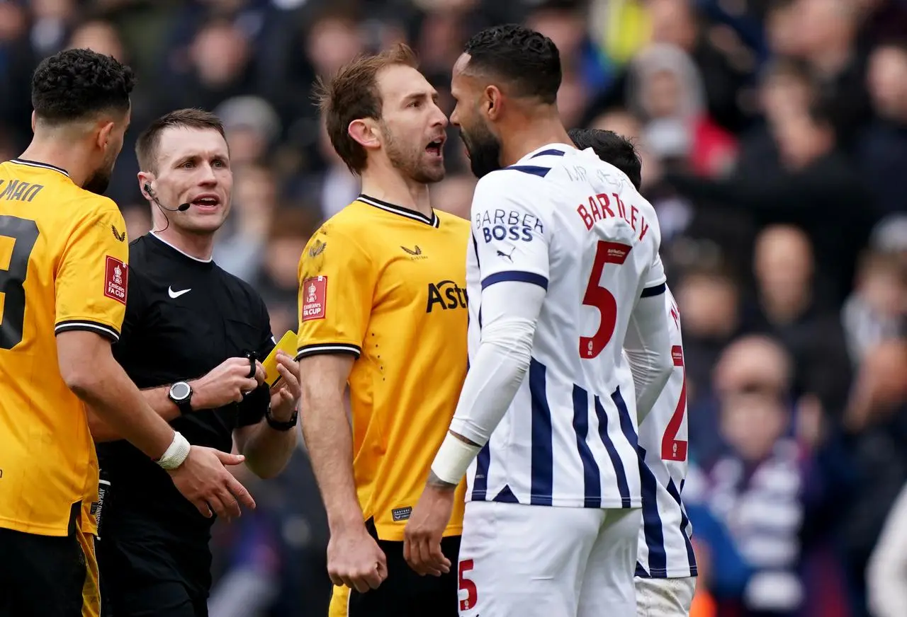 Craig Dawson (left) and Kyle Bartley clash (Bradley Collyer/PA)