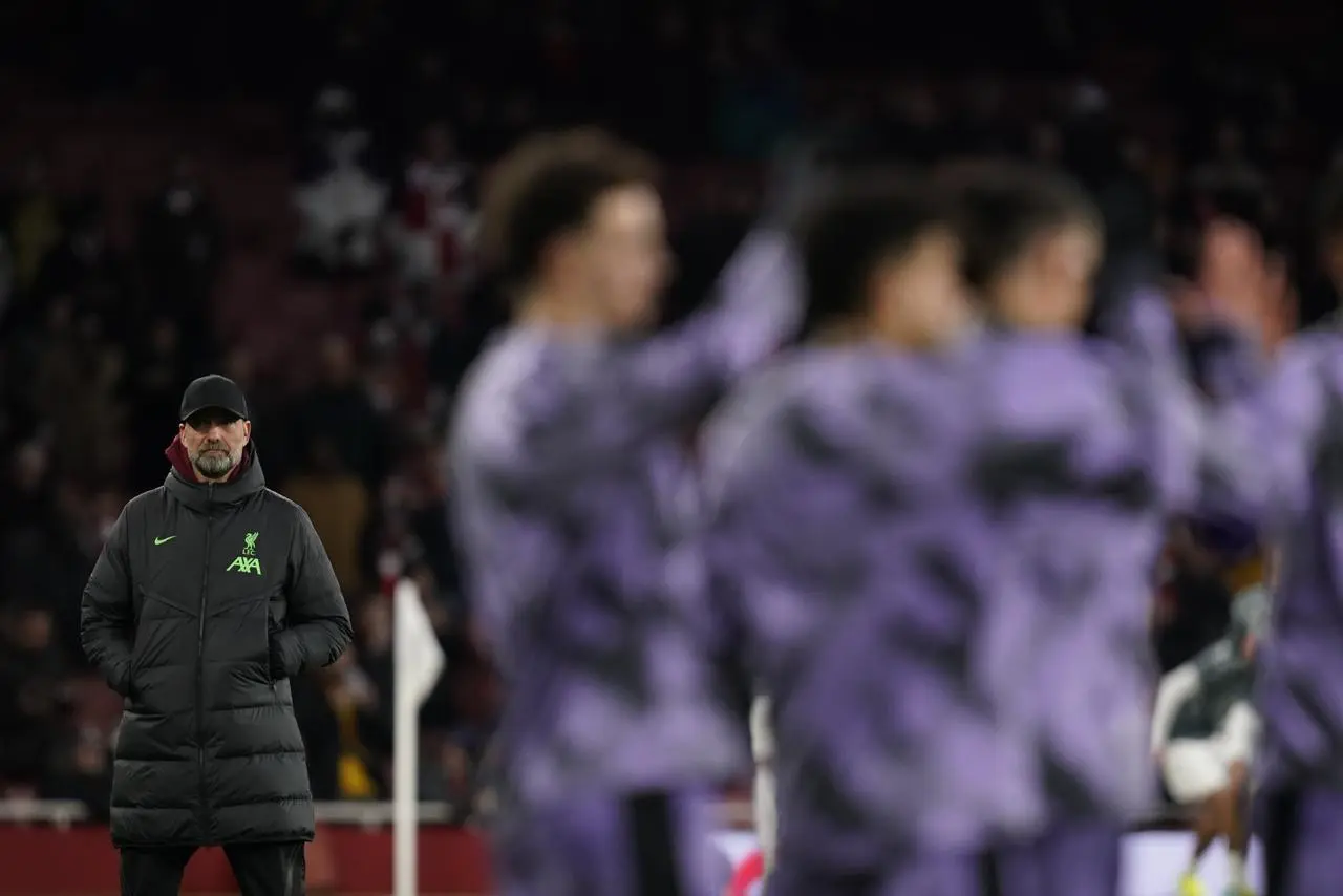 Liverpool manager Jurgen Klopp watches his squad warm up