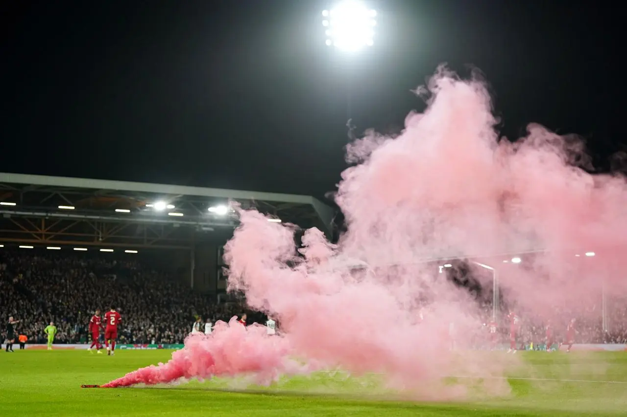 A smoke flare was thrown on to the pitch after Liverpool's goal