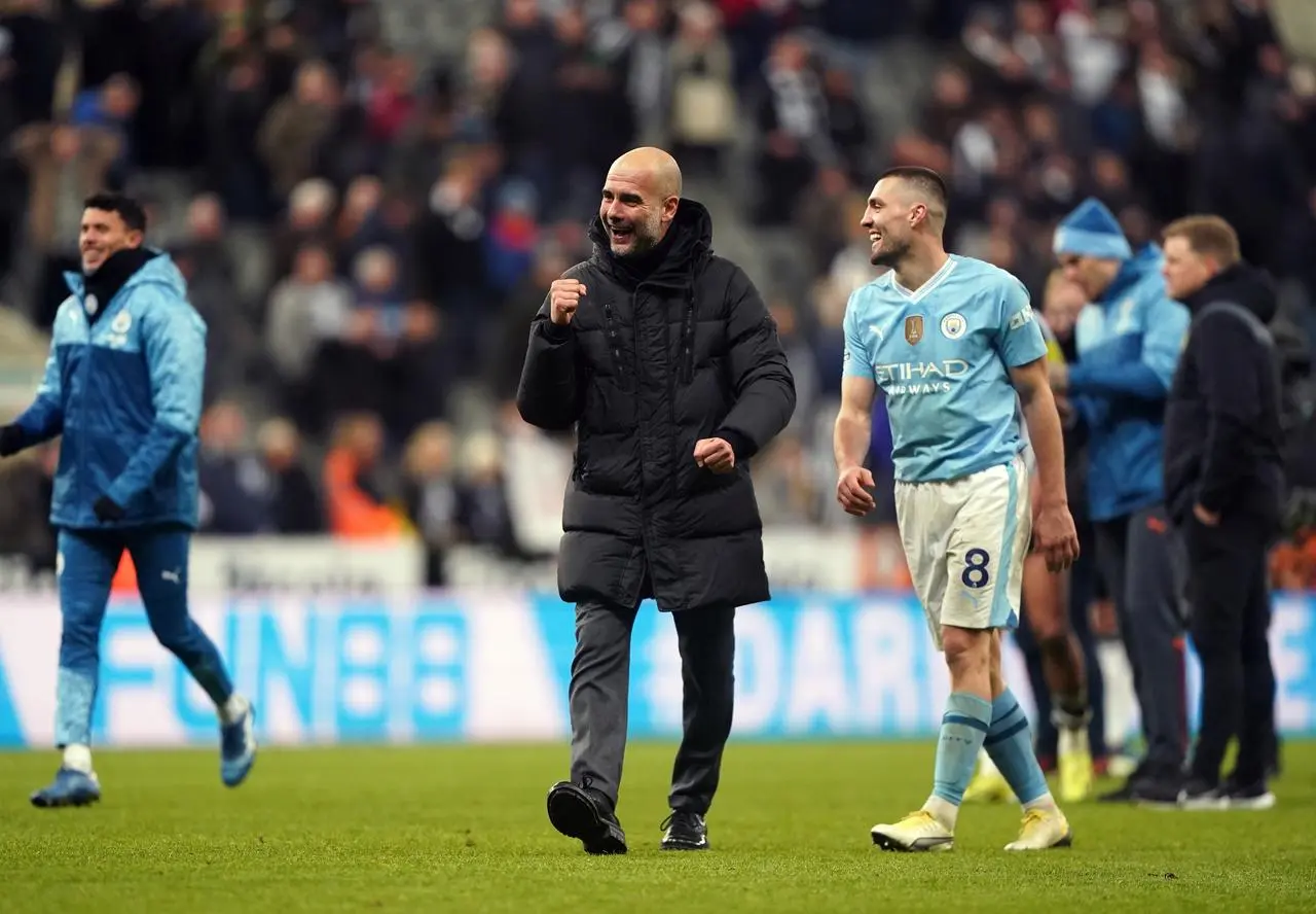 Manchester City boss Pep Guardiola celebrates victory at St James' Park