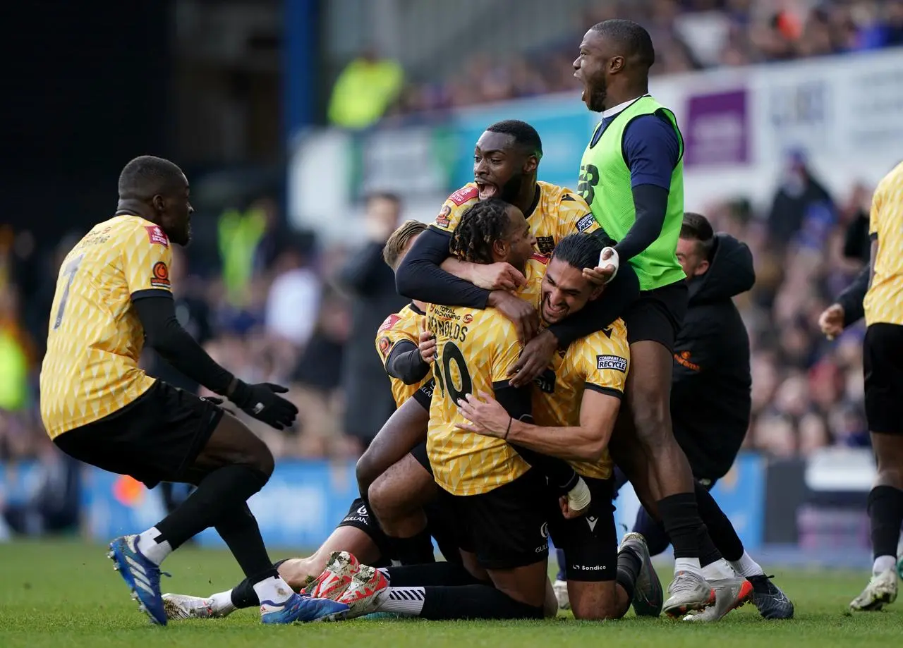 Lamar Reynolds, centre, and Maidstone celebrate their opener at Ipswich