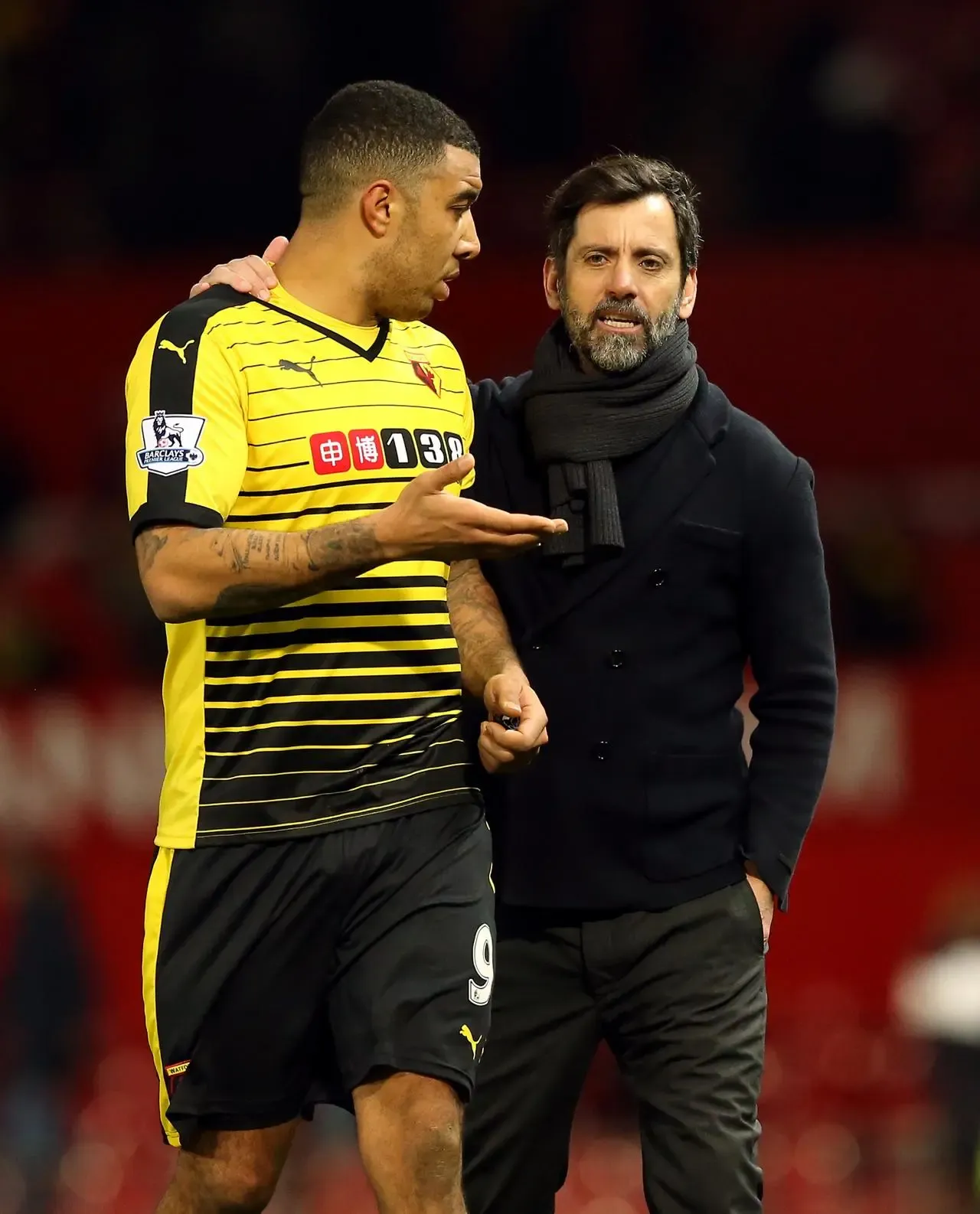 Troy Deeney, left, speaks with Watford manager Quique Sanchez Flores in 2016