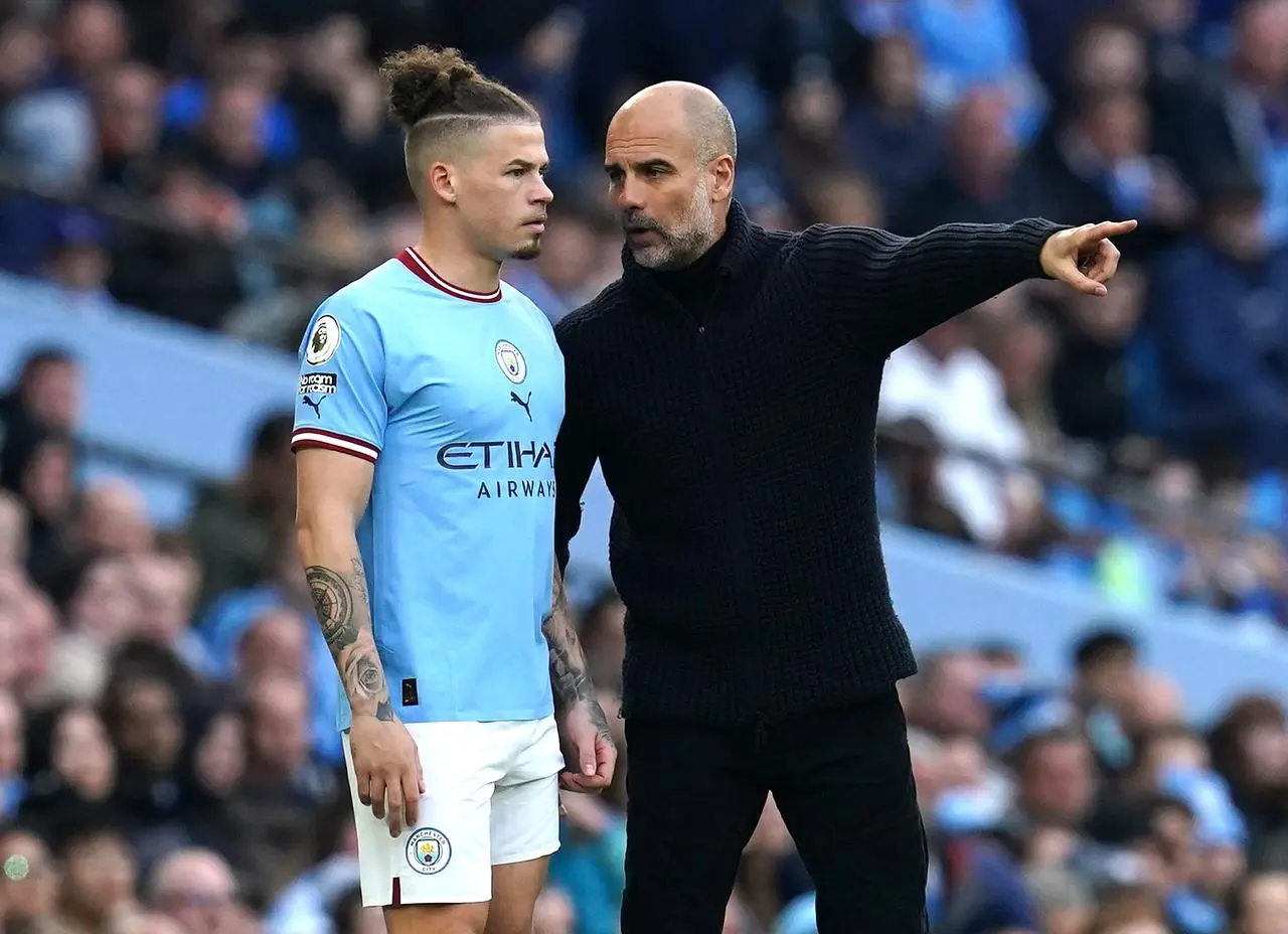 Pep Guardiola speaks to Phillips (Nick Potts/PA)