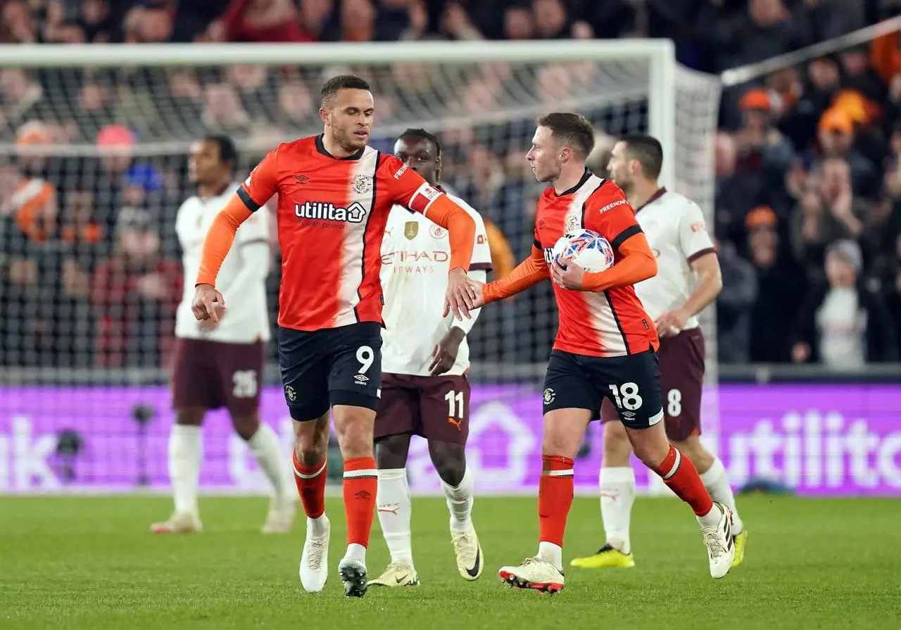 Luton’s Jordan Clark, right, celebrates his second goal