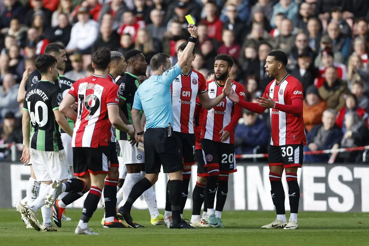 Mason Holgate, extreme right, is sent off against Brighton