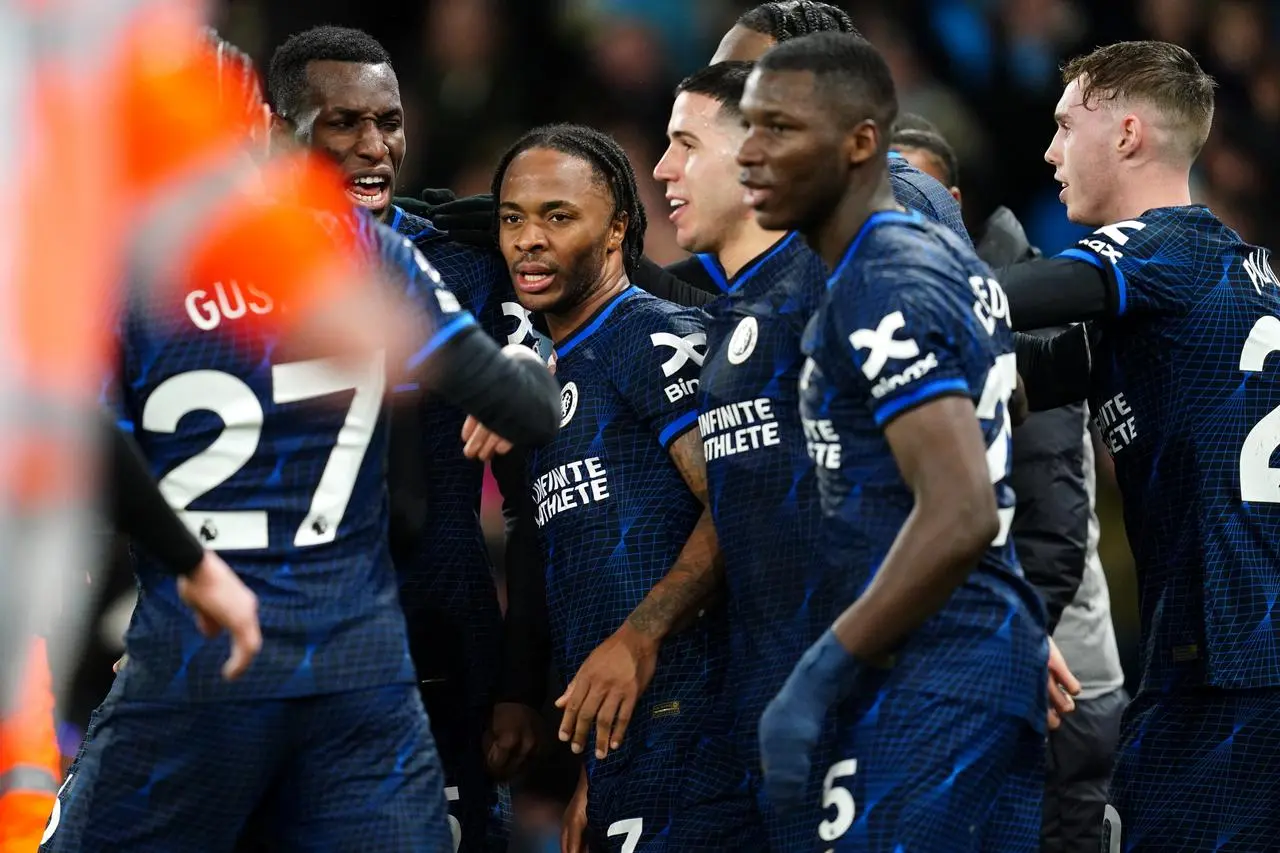 Raheem Sterling, centre, celebrates with team-mates after scoring Chelsea’s goal against Manchester City