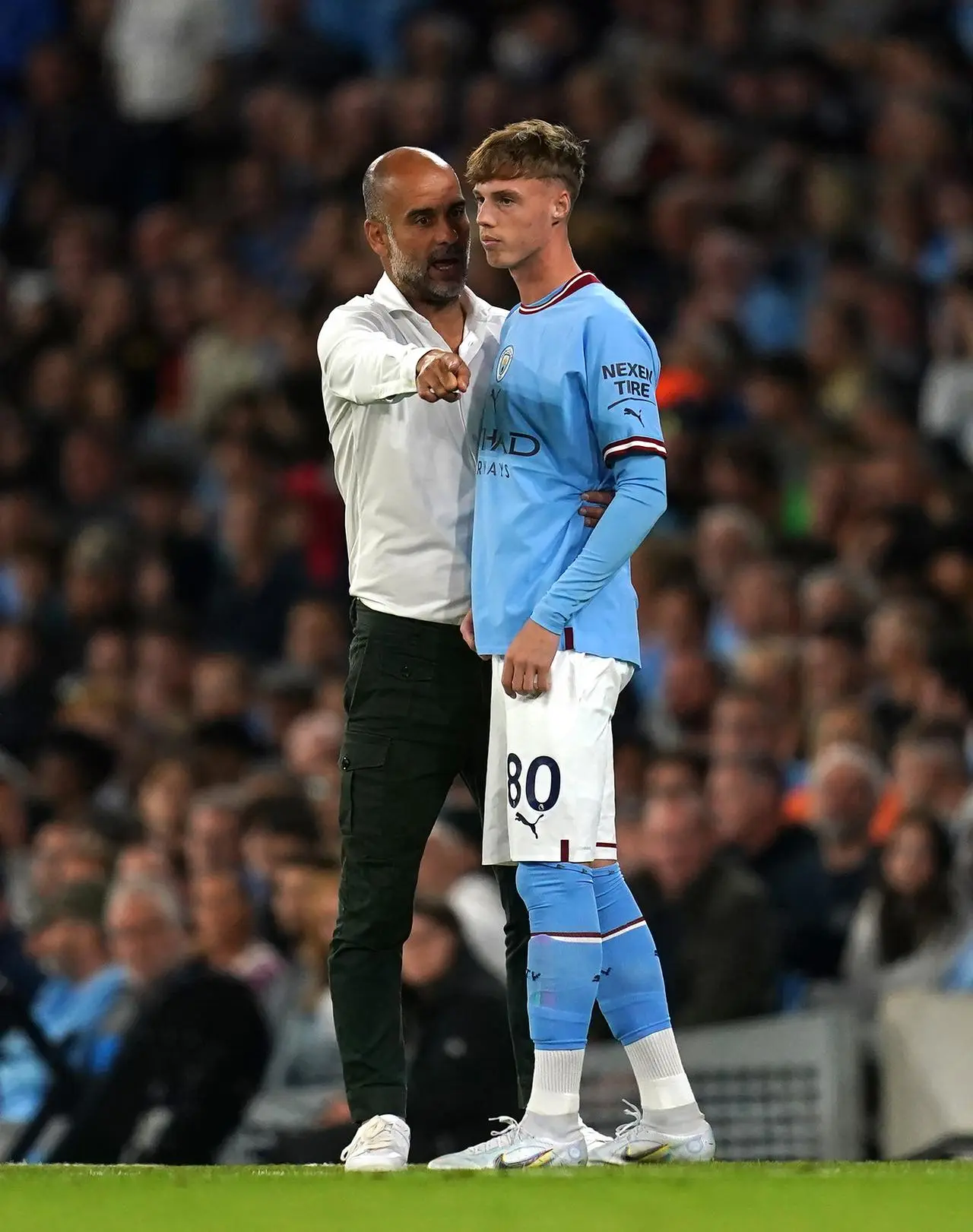 Pep Guardiola and Cole Palmer