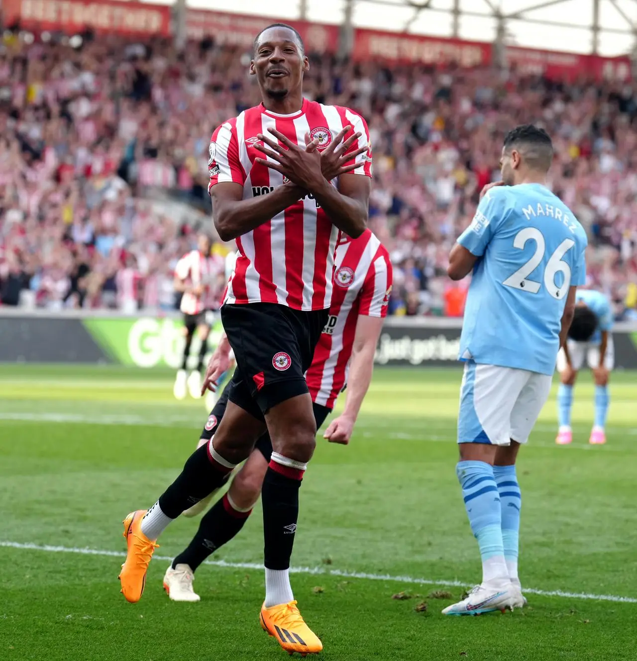 Ethan Pinnock celebrates scoring against Manchester City