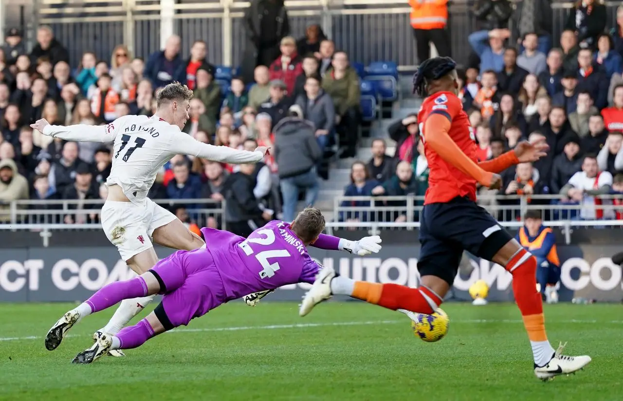 Rasmus Hojlund, left, scores Manchester United’s first goal against Luton