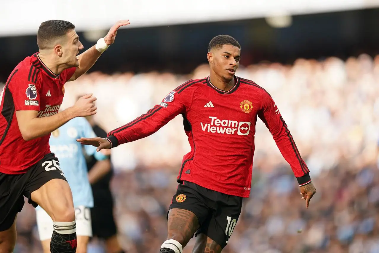 Marcus Rashford, right, celebrates