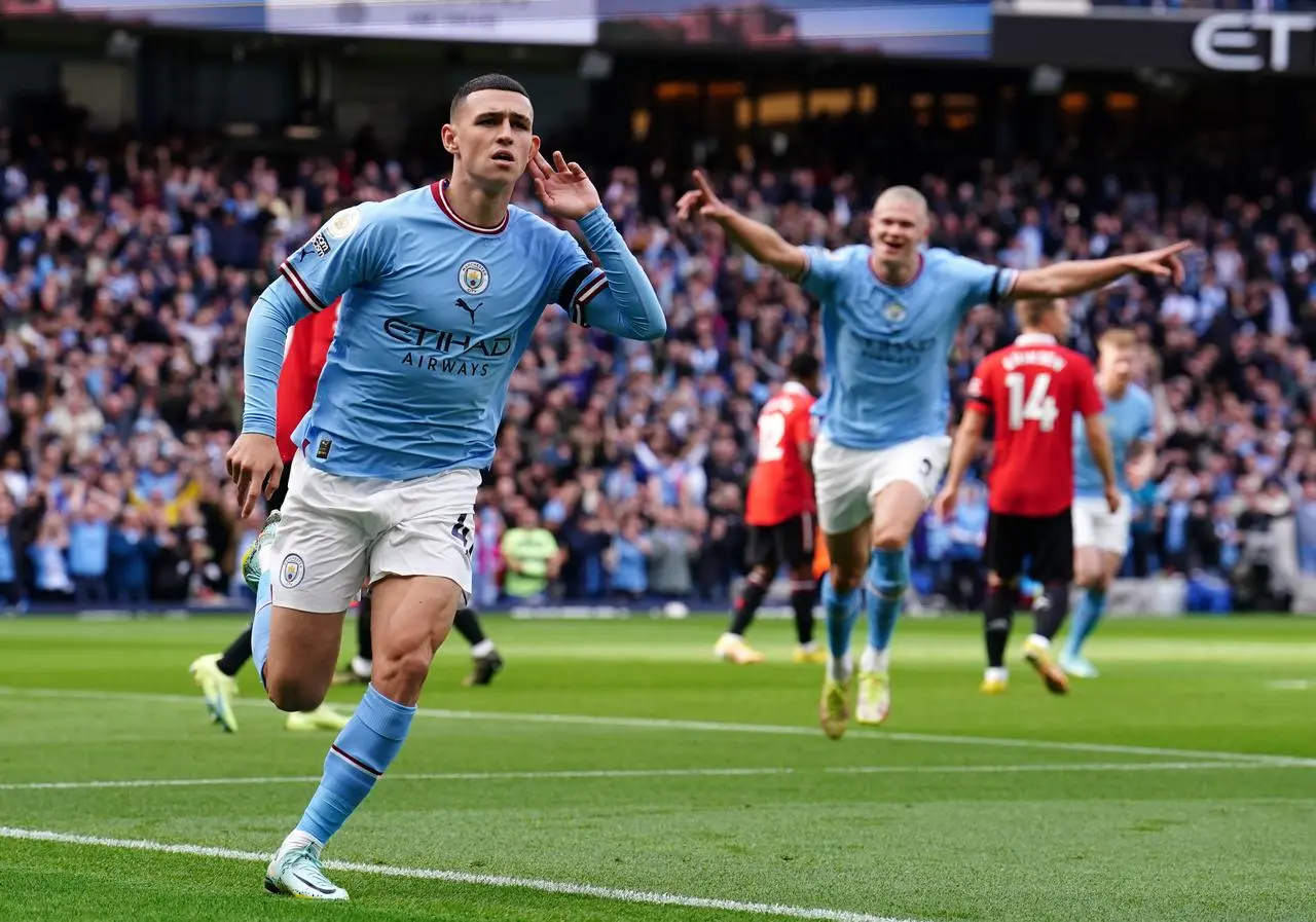 Phil Foden celebrates scoring against Manchester United