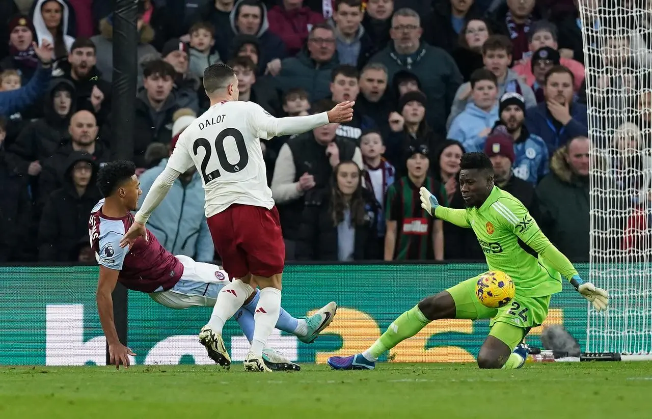 Andre Onana, right, saves from Aston Villa’s Ollie Watkins