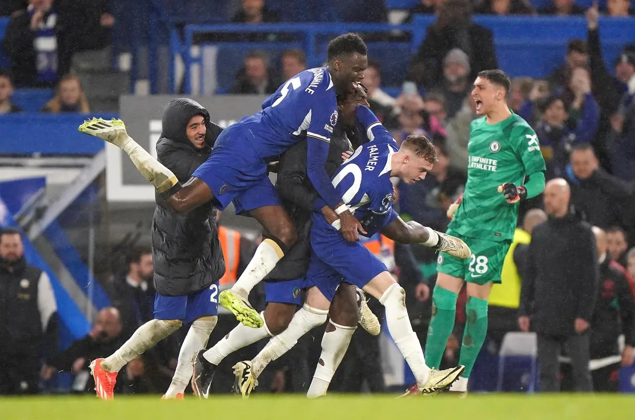 Chelsea’s Cole Palmer, right, celebrates his late winner against Manchester United