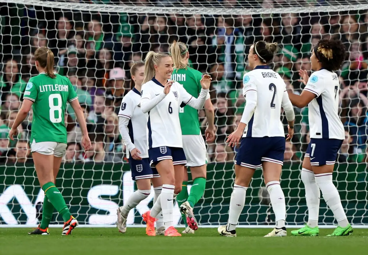 Alex Greenwood, centre, celebrates her goal