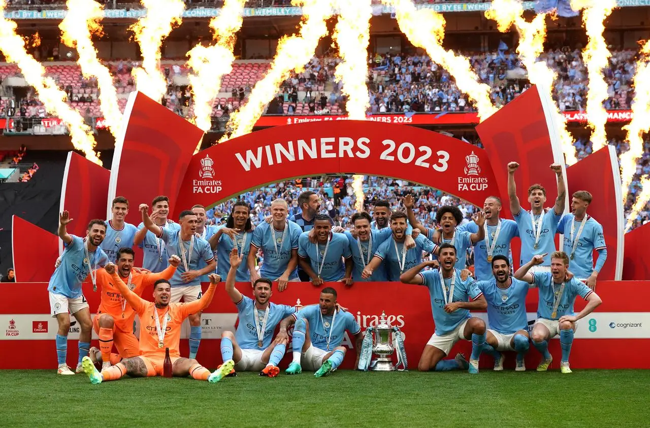 Manchester City celebrate with the FA Cup trophy after last year's final