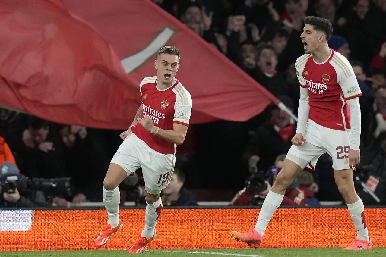 Leandro Trossard, left, celebrates after scoring Arsenal’s equaliser