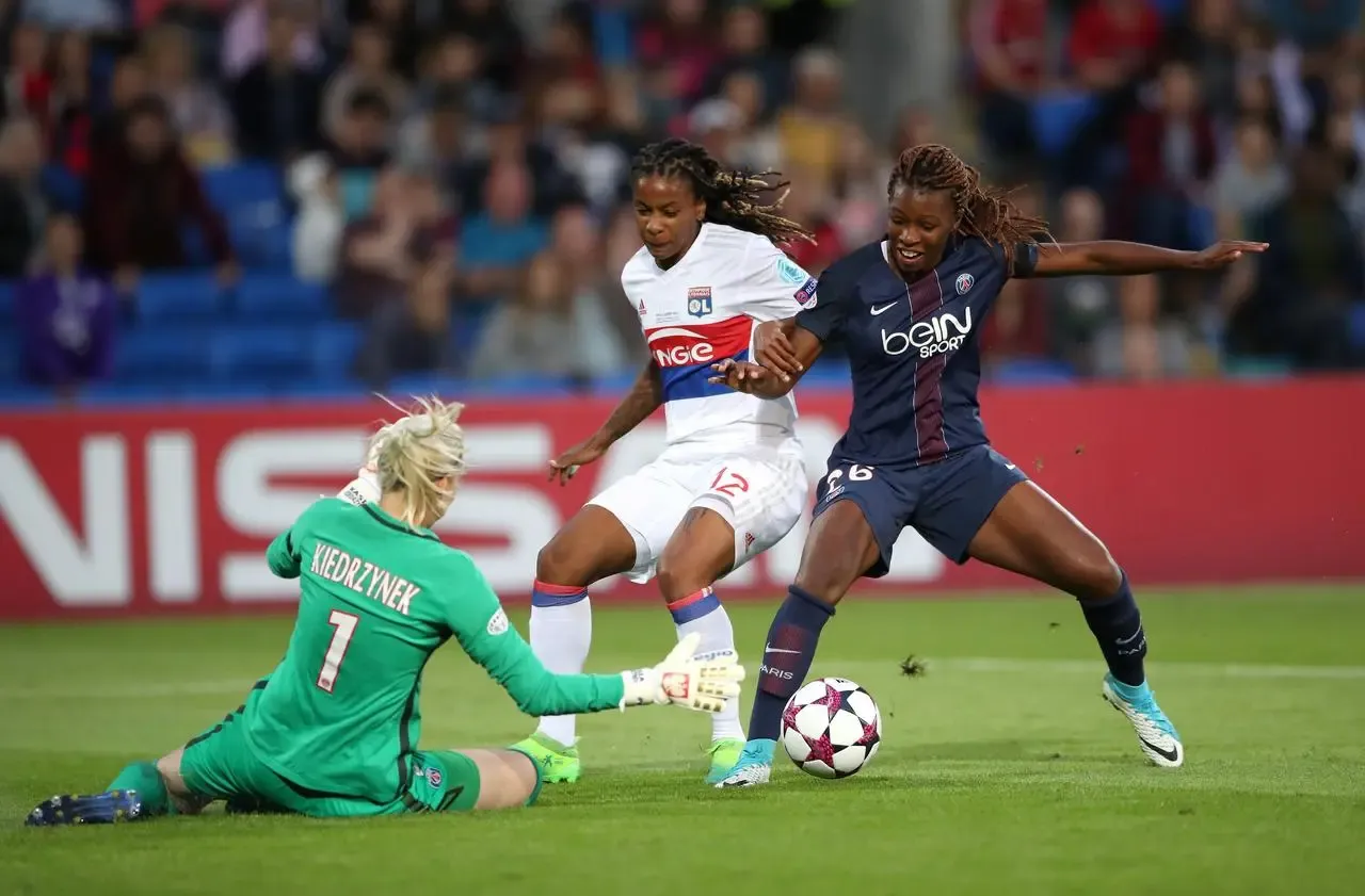 Paris St Germain’s Grace Geyoro and Lyon’s Elodie Thomis in action (Nick Potts/PA)