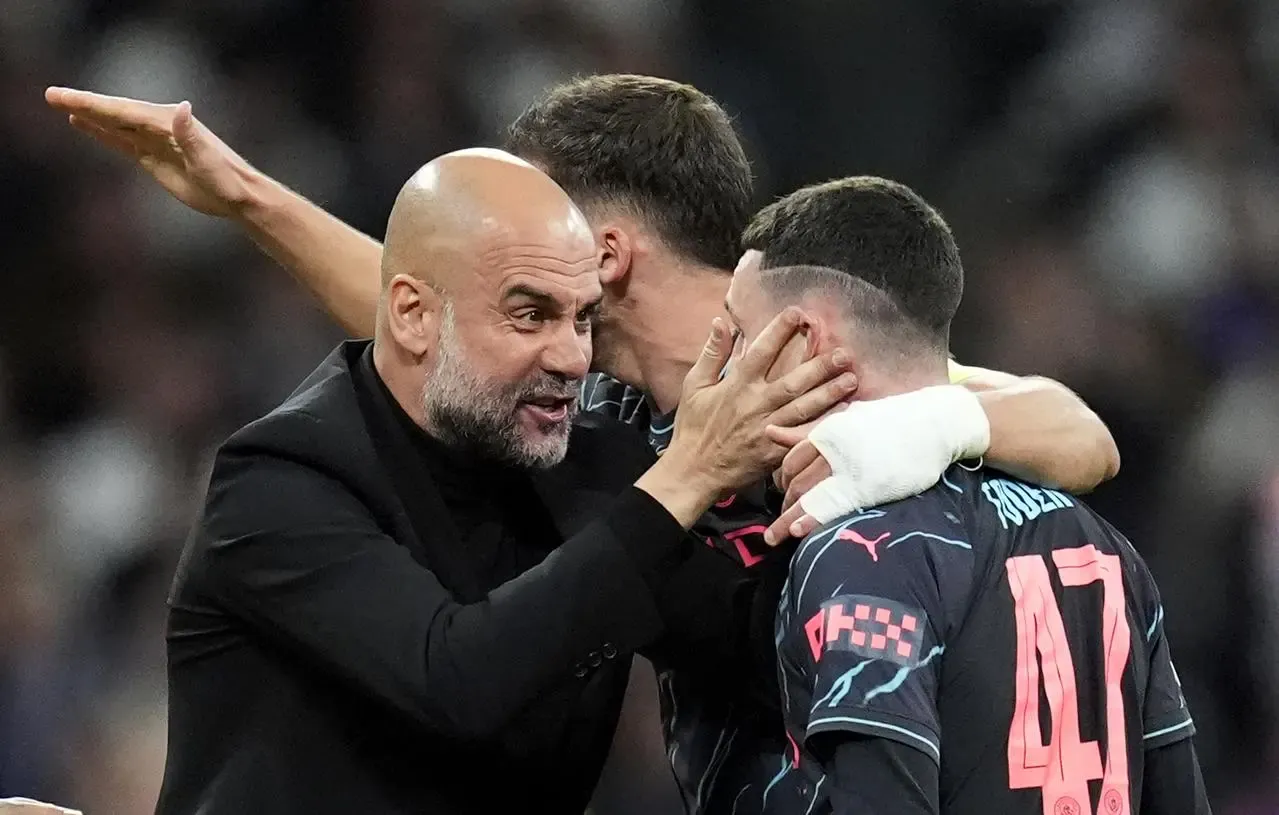 Pep Guardiola and Phil Foden