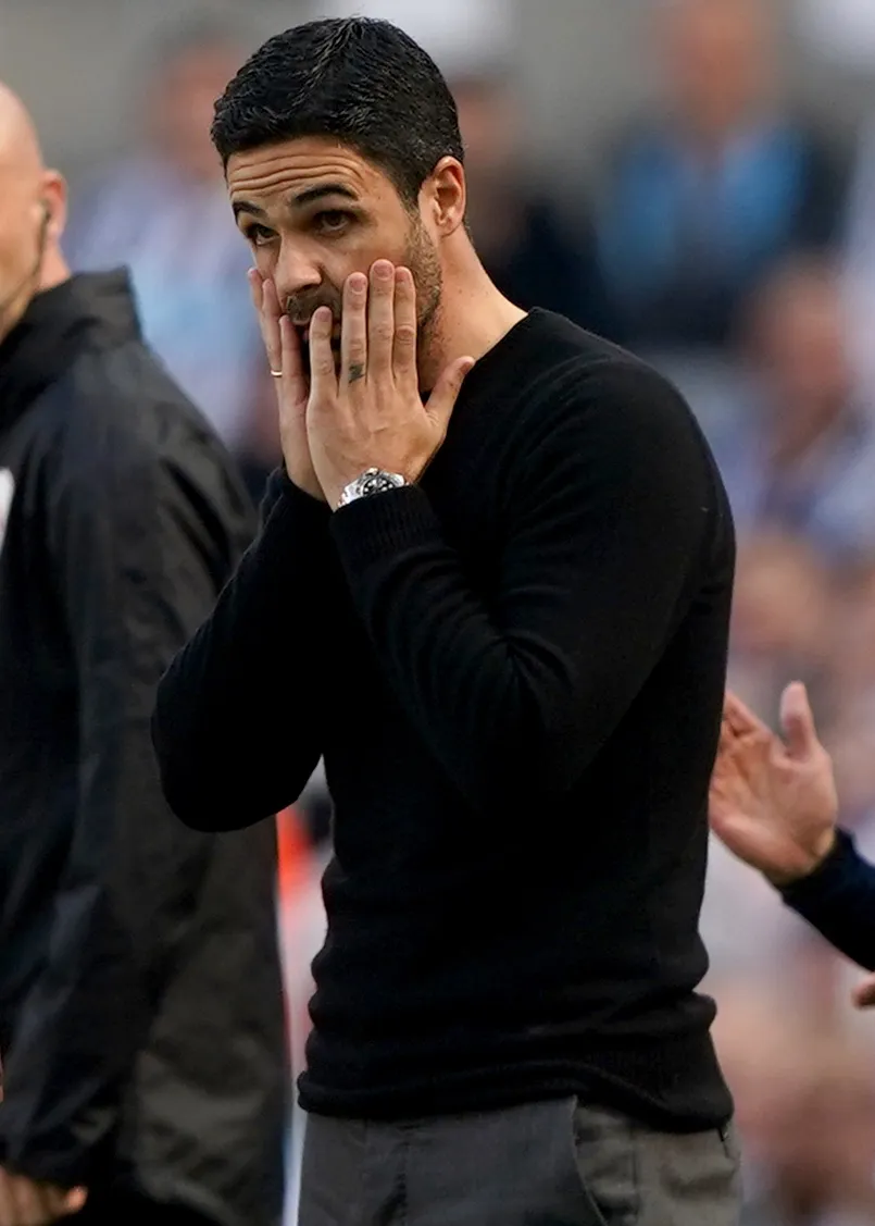 Mikel Arteta puts his hands to his face during Arsenal's game at Newcastle last season