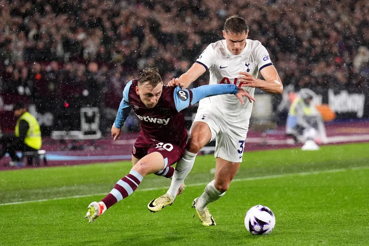 West Ham’s Jarrod Bowen, left, takes on Micky van de Ven