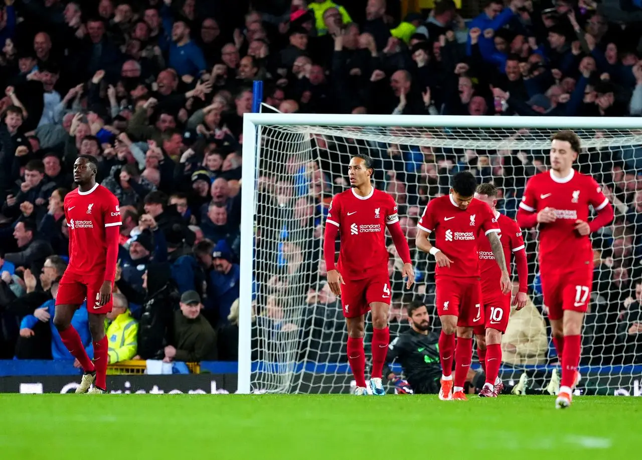Liverpool players appear dejected 