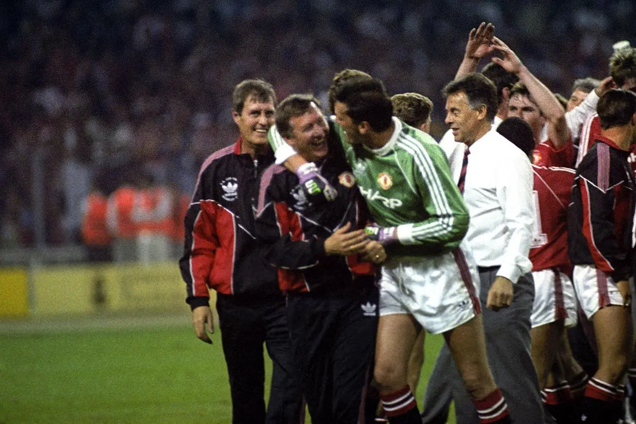 Sir Alex Ferguson celebrates with goalkeeper Les Sealey after winning the FA Cup