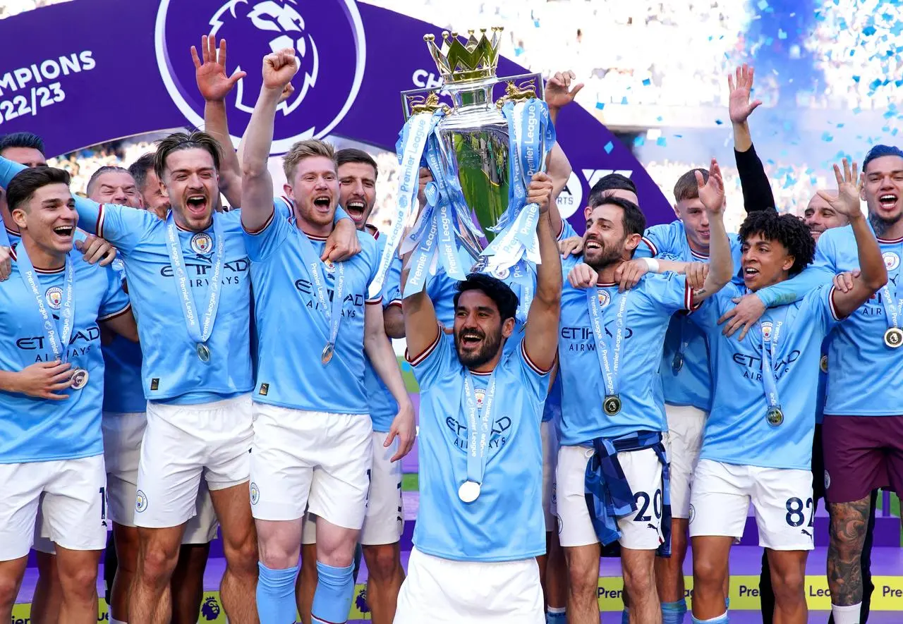 Manchester City’s Ilkay Gundogan lifts the Premier League trophy 