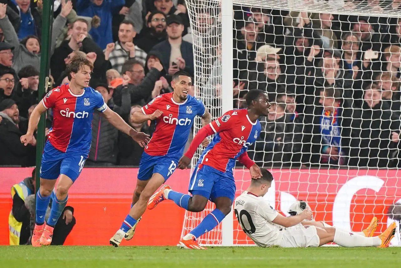 Tyrick Mitchell (centre right) celebrates scoring Crystal Palace's third