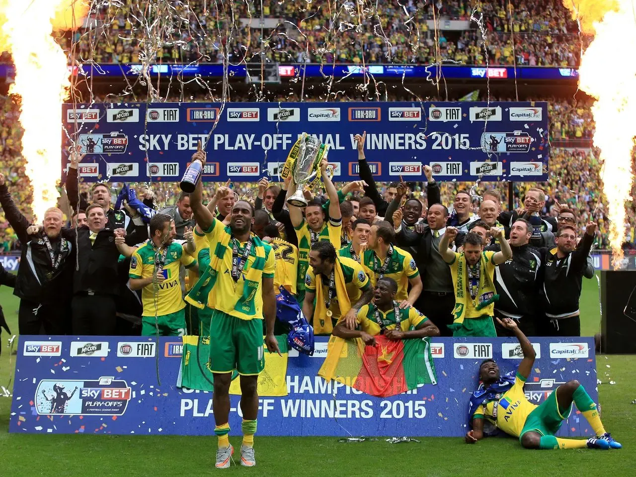 Norwich City’s Cameron Jerome celebrates in front of players and staff celebrate at Wembley