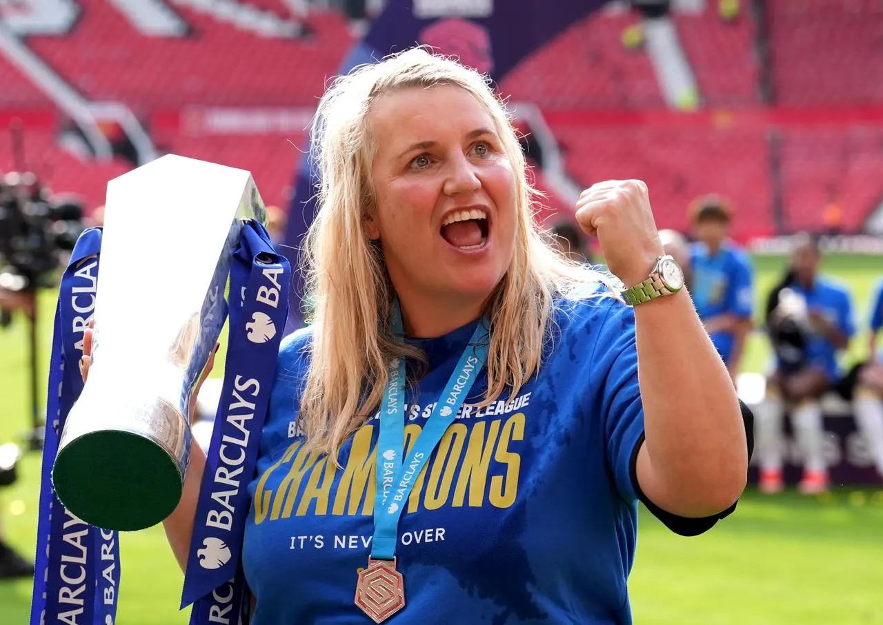 Chelsea manager Emma Hayes celebrates with the trophy after winning the Barclays Women’s Super League and her final match as manager of the club at Old Trafford