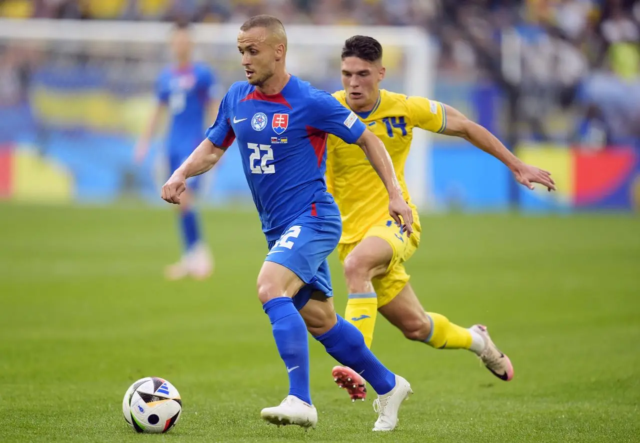 Stanislav Lobotka takes the ball against Ukraine 