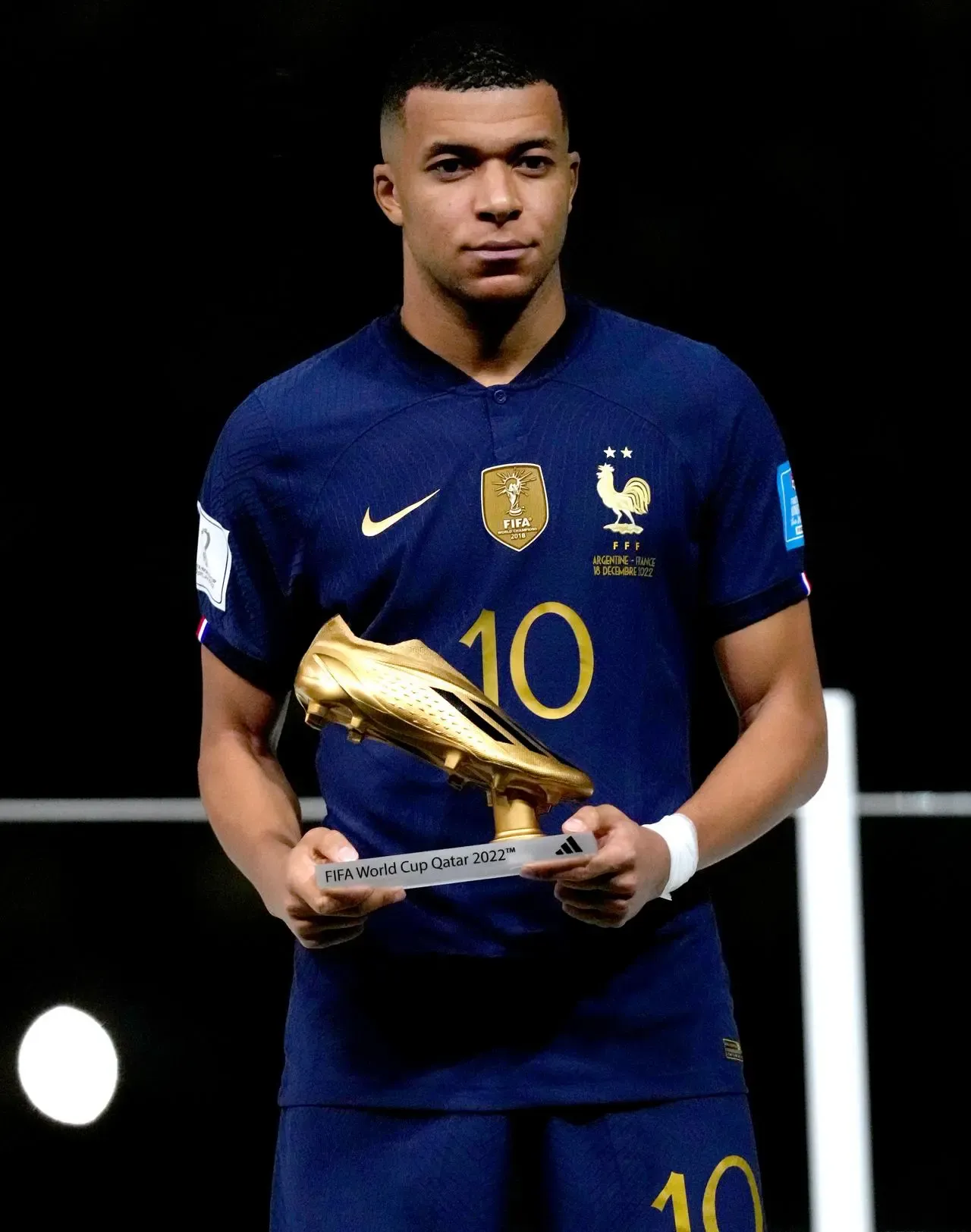 Kyilan Mbappe with the 2022 World Cup Golden Boot trophy