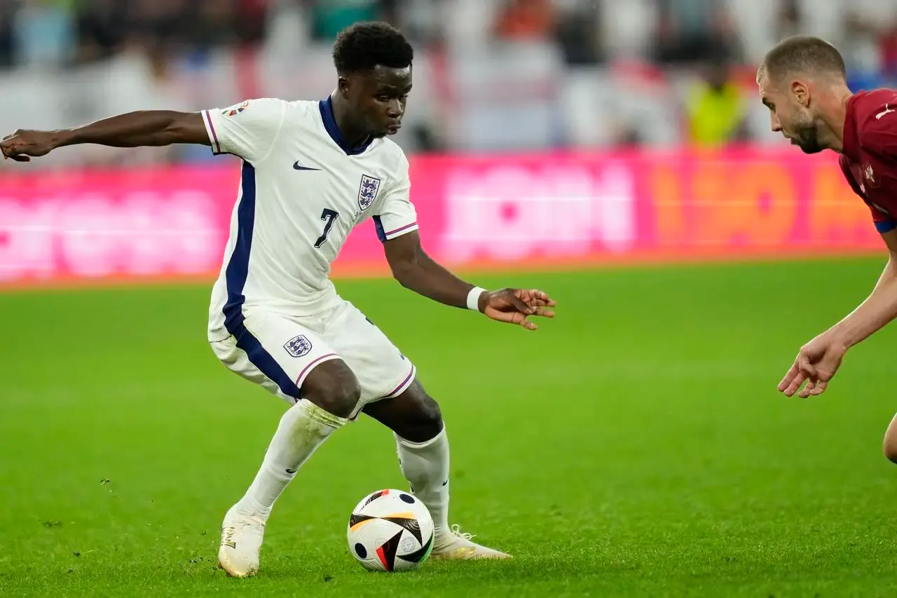 England’s Bukayo Saka, left, challenges for the ball with Serbia’s Strahinja Pavlovic during their Euro 2024 fixture