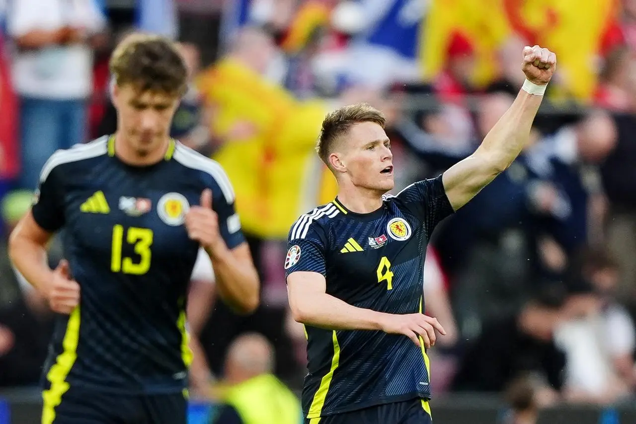 Scott McTominay, right, celebrates his opener against Switzerland 