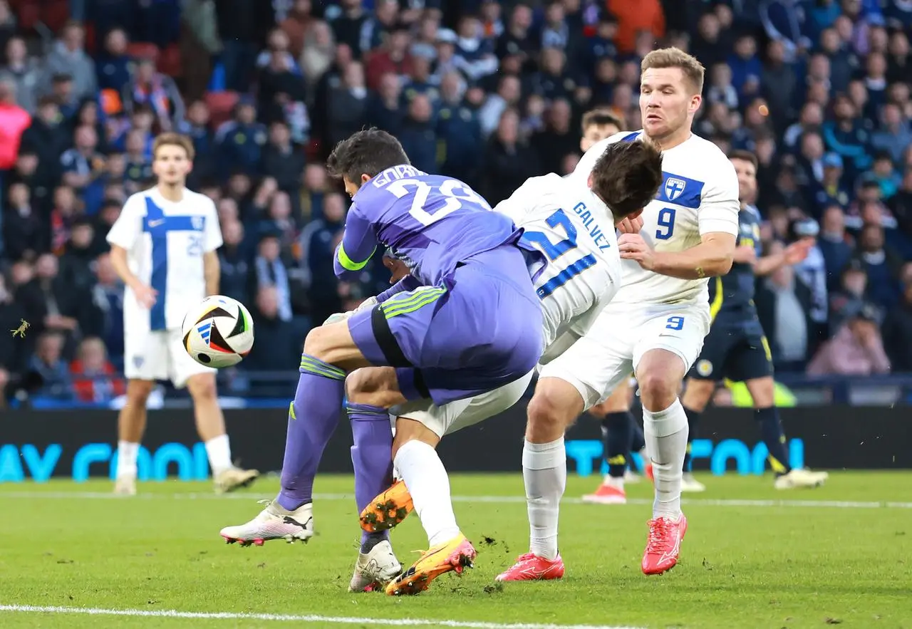 Scotland goalkeeper Craig Gordon collides with Finland's Tomas Galvez