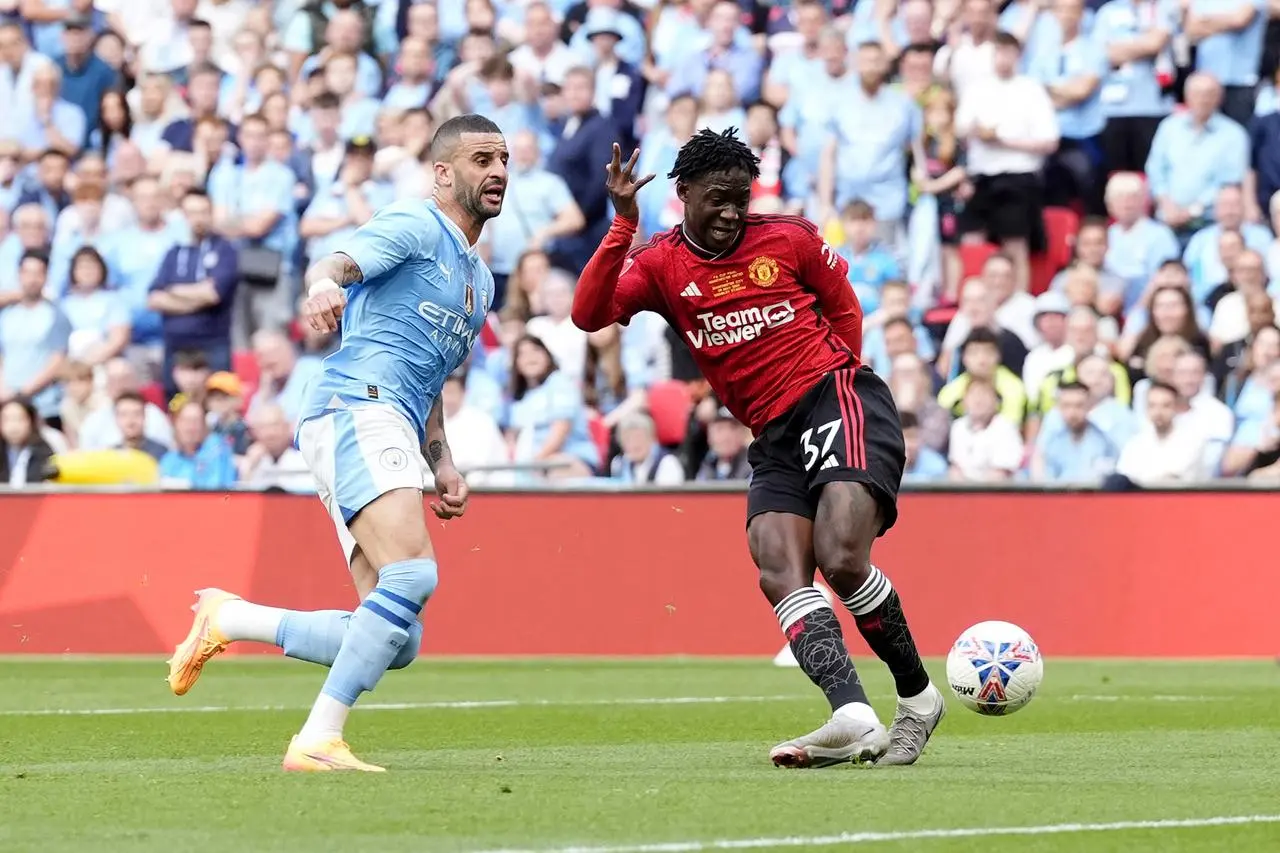 Manchester United’s Kobbie Mainoo scores their sides second goal of the game in the FA Cup final