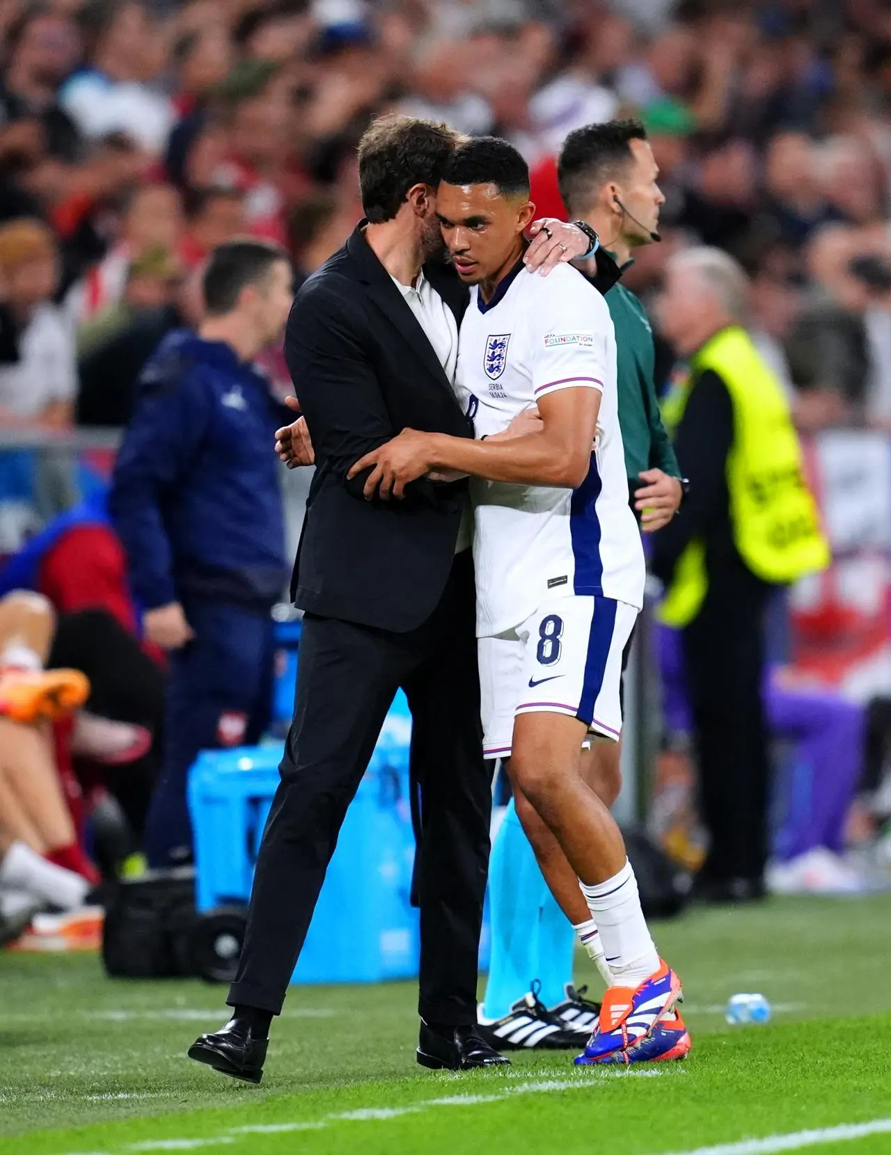 Trent Alexander-Arnold is embarced by manager Gareth Southgate after being substituted against Serbia