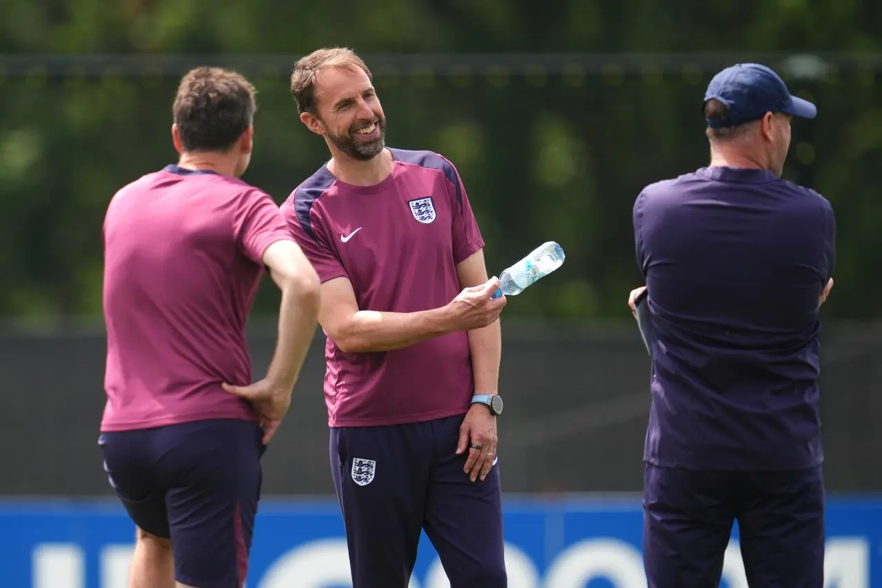 Gareth Southgate talks to his coaching staff