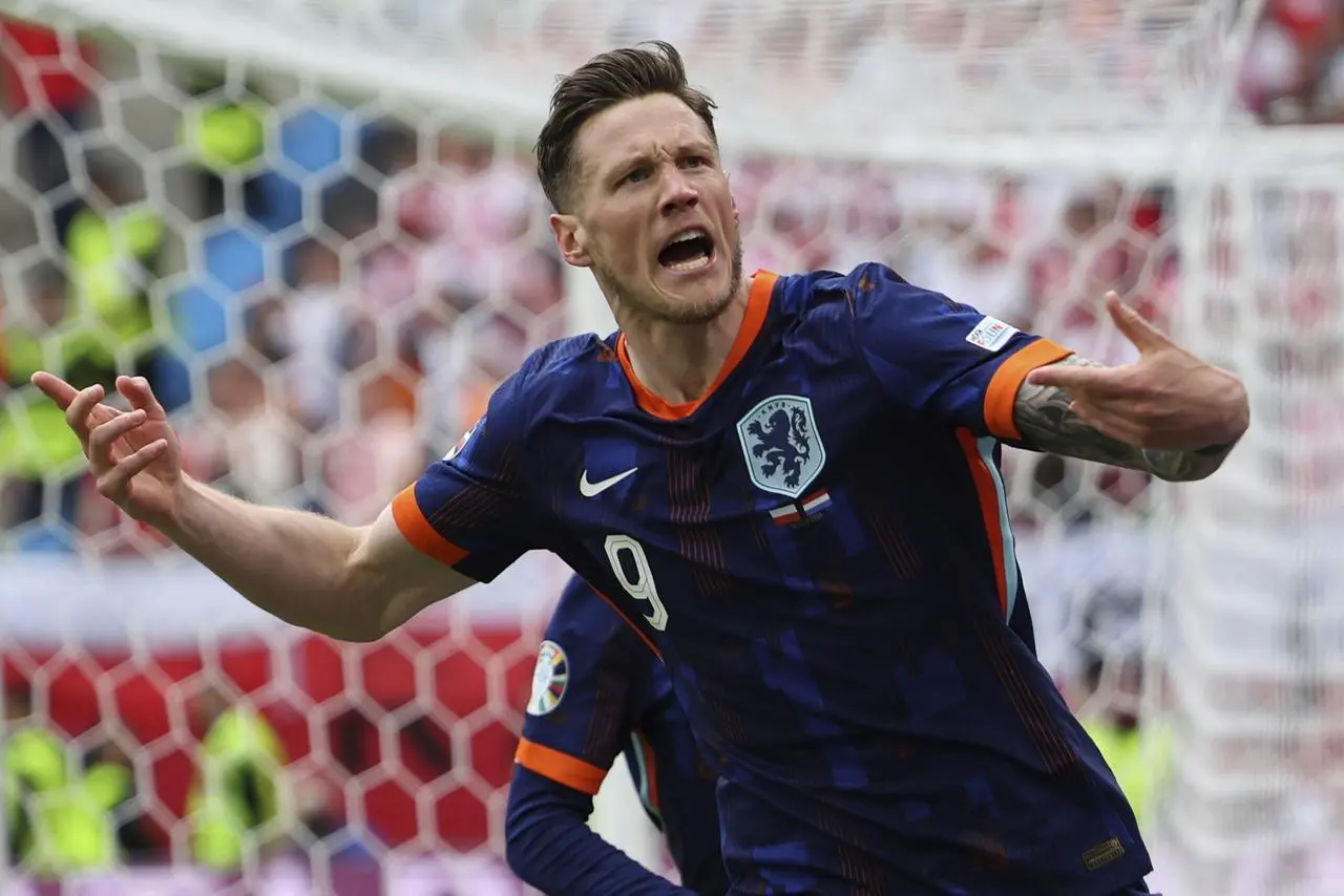 Wout Weghorst celebrates scoring the Netherlands' winner against Poland