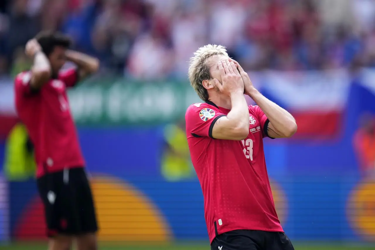 Georgia’s Saba Lobjanidze reacts after a missed chance to score