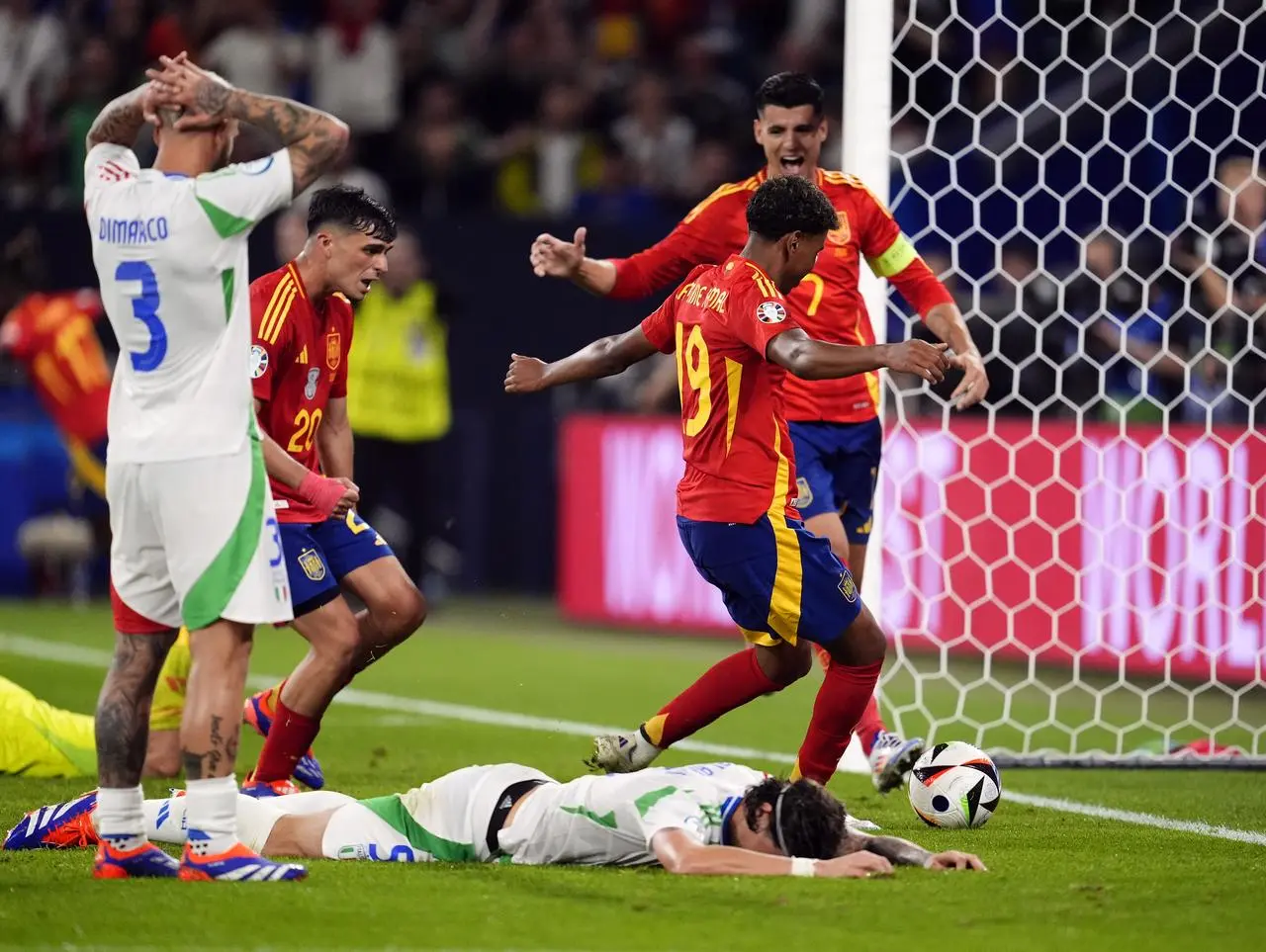 Italy’s Riccardo Calafiori (on the ground) reacts after scoring an own goal in the 1-0 Group B defeat by Spain in Gelsenkirchen