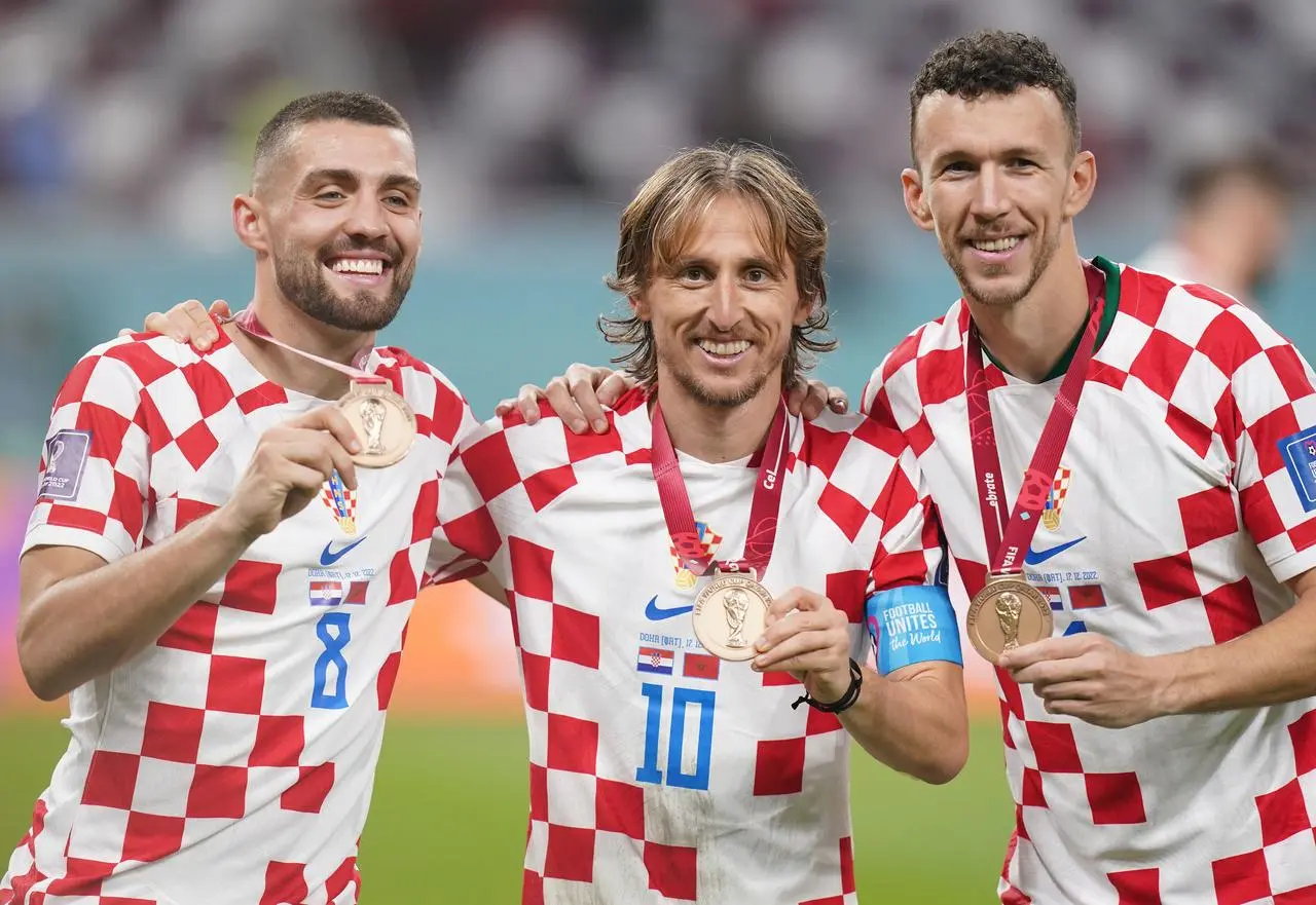 Croatia’s Mateo Kovacic, Luka Modric and Ivan Perisic, left to right