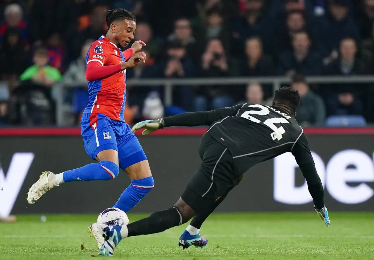 Crystal Palace's Michael Olise attempts to dribble past Manchester United goalkeeper Andre Onana