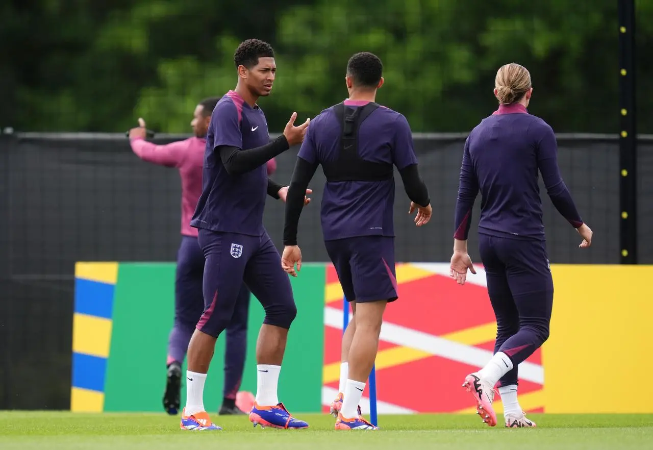 England’s Jude Bellingham (left) speaks to Trent Alexander-Arnold during an England training session