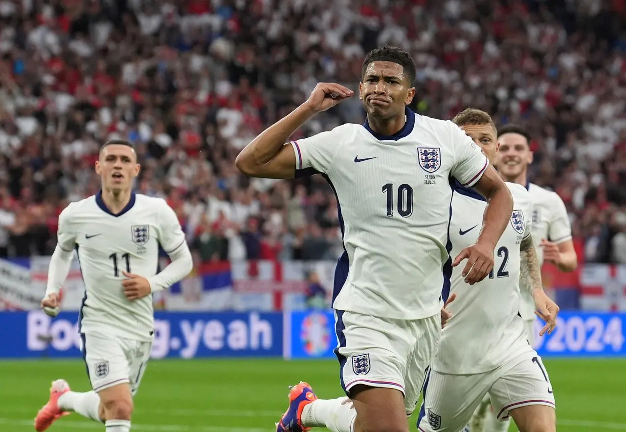 Jude Bellingham celebrates his goal as team-mates run to him