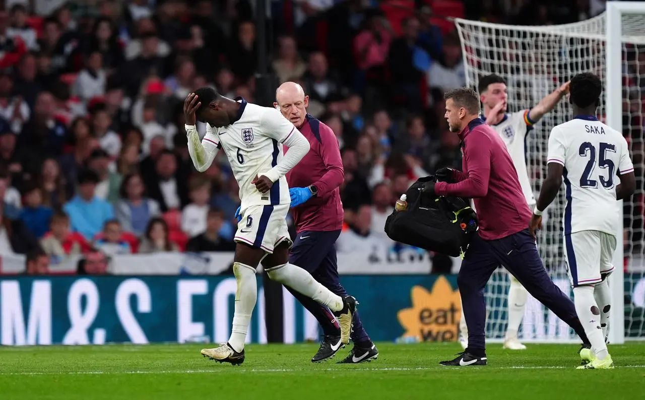 England defender Marc Guehi runs off the pitch after receiving treatment on the pitch