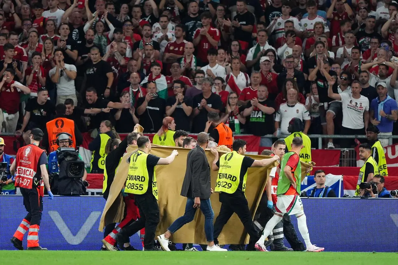 Barnabas Varga leaves the pitch on a stretcher following an injury during Hungary's clash with Scotland