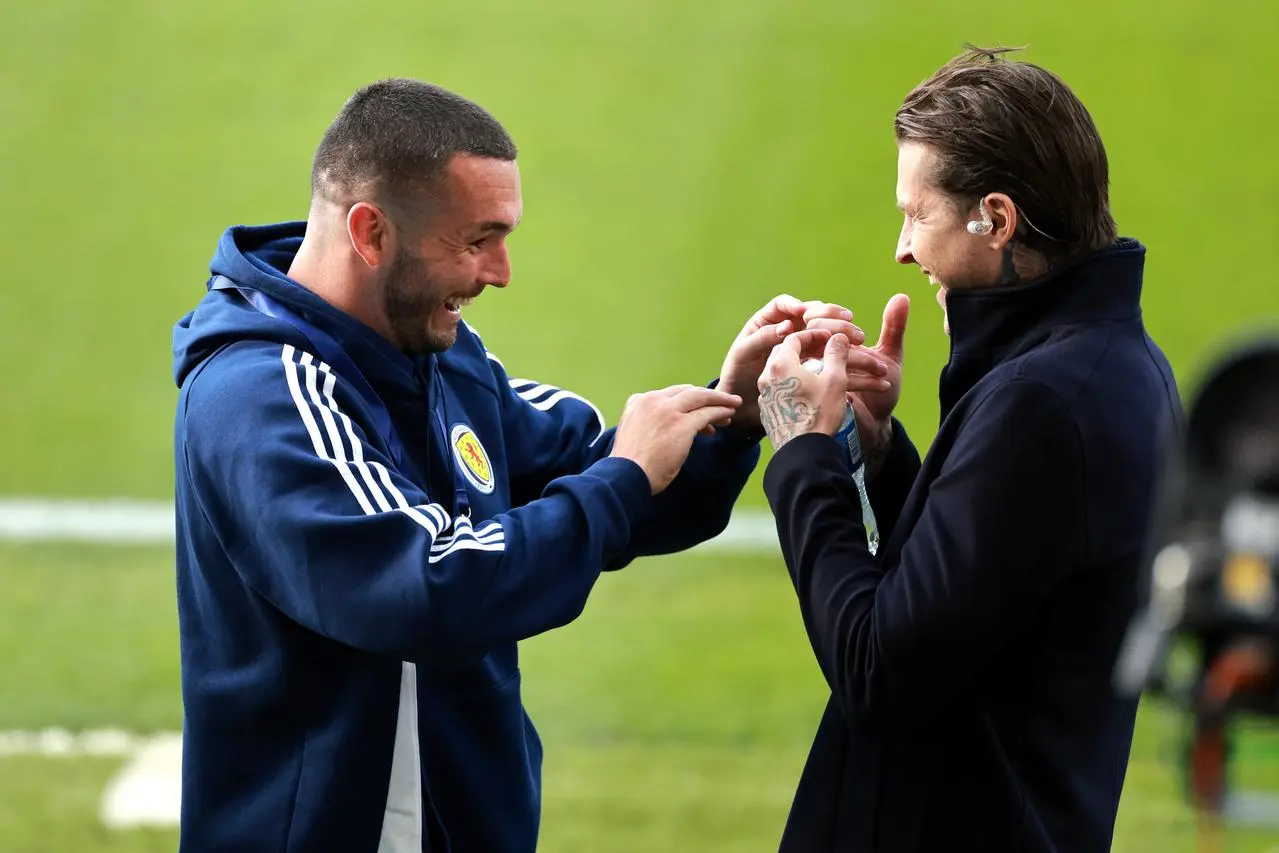 John McGinn greets Lyndon Dykes